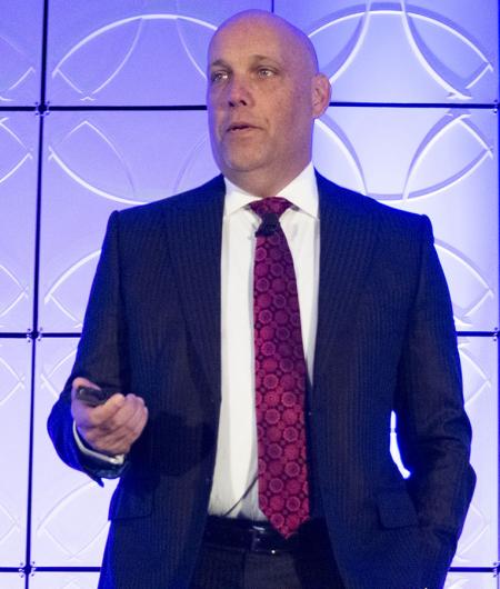 kevin Switick addresses the audience at AUVSI Unmanned Systems Defense. Protection. Security in 2019. 