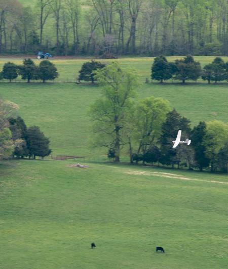 An AeroVironment Puma flies over Virginia farmland. Photo: MAAP