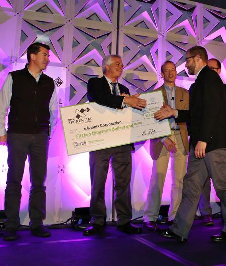 The winner of the 2017 Startup Showdown, uAvionix, accepts their award. Photo: Robb Cohen Photo & Video