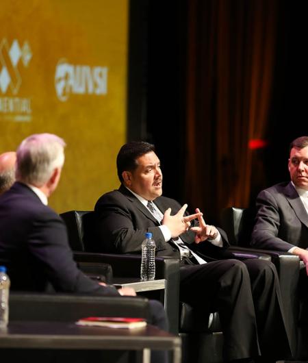 Andrew Velasquez III, managing deputy commissioner of the Safety and Security Division of CDA, second from right, and Matt Cornelius, EVP of Airports Council International - North America, discuss the task force at AUVSI Xponential 2019. Photo: Becphotogr