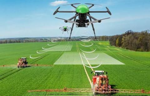 A drone communicates with a ground vehicle on a farm. Image: AgriTech Tomorrow. A drone communicates with a ground vehicle on a farm. Image: AgriTech Tomorrow.