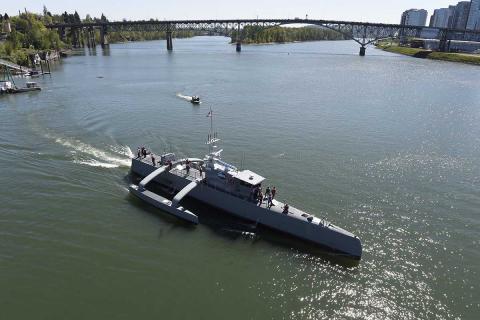 Sea Hunter, a medium-sized USV, gets underway on the Williamette River, Portland, Oregon, 2017, following a christening ceremony. The Navy would like more USVs of all sizes. Photo: U.S Navy/John F. Williams Sea Hunter, a medium-sized USV, gets underway on the Williamette River, Portland, Oregon, 2017, following a christening ceremony. The Navy would like more USVs of all sizes. Photo: U.S Navy/John F. Williams