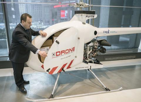Tony Di Benedetto, CEO of Drone Delivery Canada opens the cargo bay door of his company's newest, largest and farthest range cargo delivery drone, the Condor. THE CANADIAN PRESS IMAGES/J.P. Moczulski (CNW Group/Drone Delivery Canada)