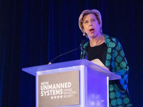 The Honorable Ellen Lord, Under Secretary of Defense for Acquisition and Sustainment, delivers her keynote address during AUVSI Unmanned Systems Defense. Protection. Security. Photo: AUVSI