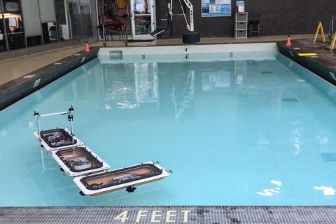 MIT’s fleet of robotic boats has been updated with new capabilities to “shapeshift,” by autonomously disconnecting and reassembling into different configurations to form various floating platforms in the canals of Amsterdam. Photo courtesy of researchers