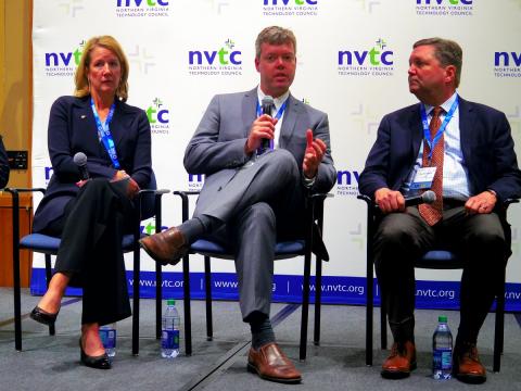 Nicholas Devereux, center, discusses Wing's landmark UAS flight in Christiansburg, Virginia during the NVTC Autonomous Technology Summit. Photo: AUVSI