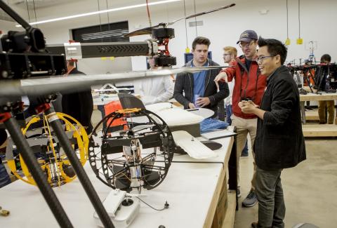 Dr. Ben Loh (right), research engineer at OSU's Unmanned Systems Research Institute, created the All Terrain Land and Air Sphere (ATLAS). Photo: OSU