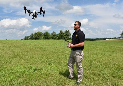 Spring Hill Police Detective Geoff Betts, an FAA certified UAS pilot, demonstrates the department’s new drone in an open field near Spring Hill City Hall. PHOTO: JAMIE PAGE, CITY OF SPRING HILL