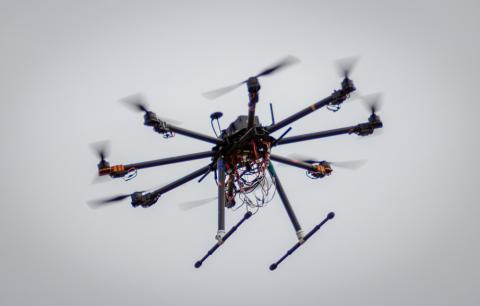 The eight-propeller drone flies above Horsebarn Hill in Storrs on a recent test flight. (Christopher Larosa/UConn Photo)